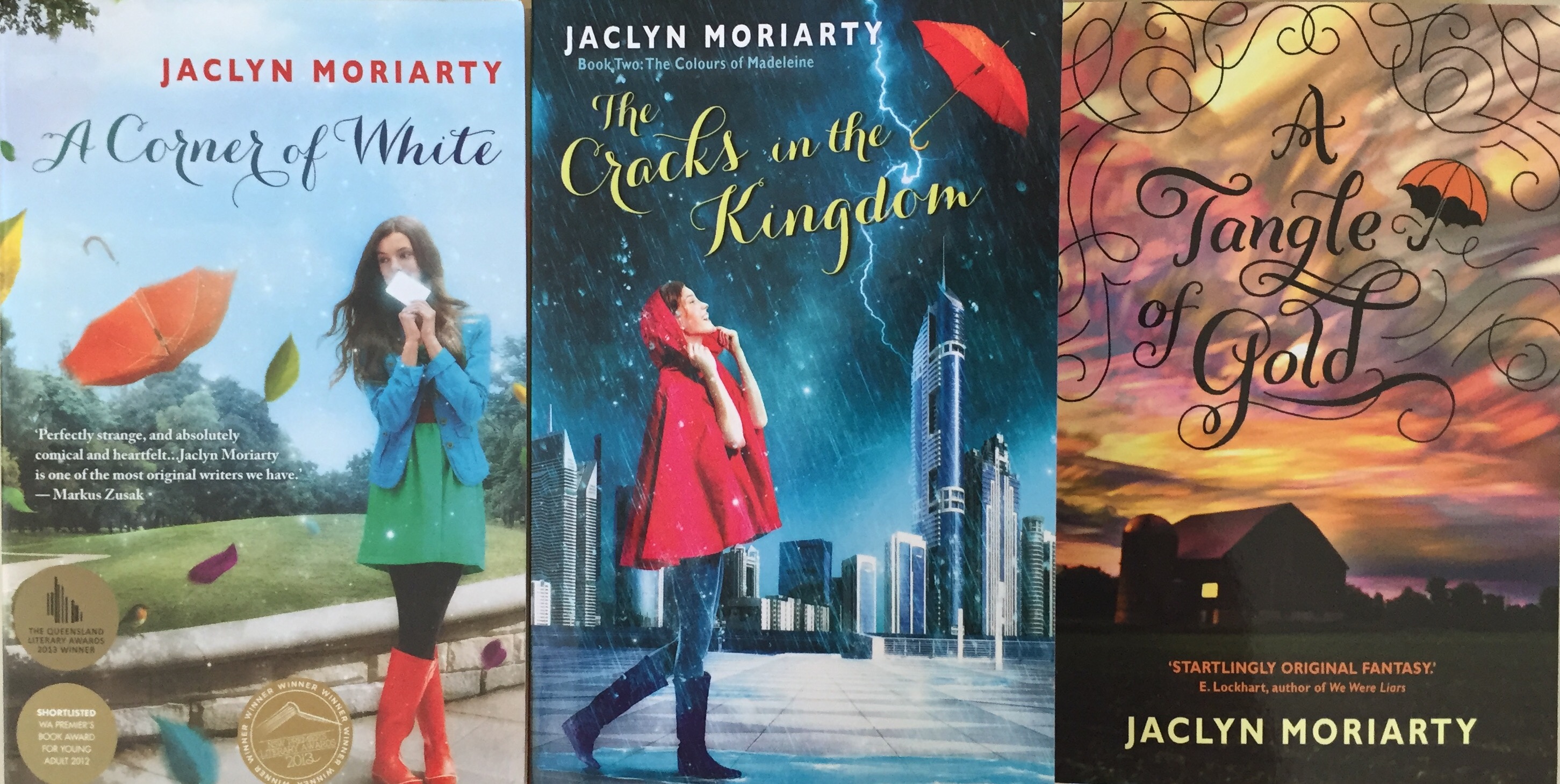 Three book covers from the Colours of Madeline series by Jaclyn Moriarty: A Corner of White, The Cracks in the Kingdom and A Tangle of Gold